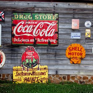 drug-store-drink-coca-cola-signage-on-gray-wooden-wall-210126